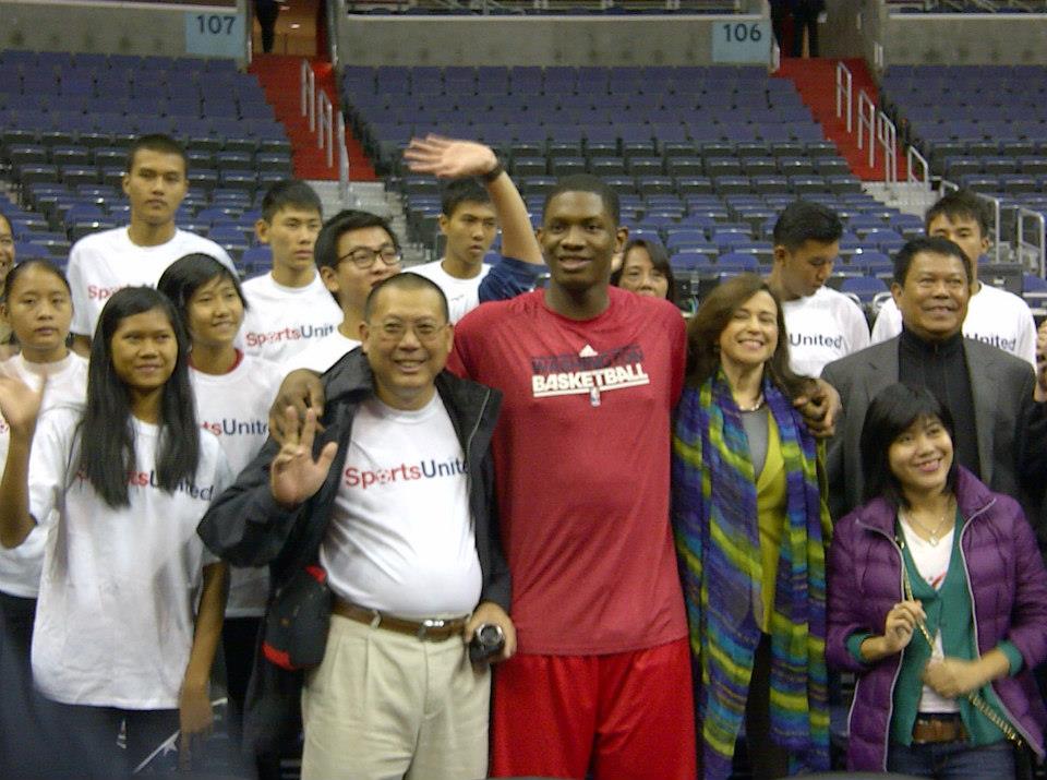 NBA Wizards player Kevin Seraphin joins for a picture with U.S. Department of State Bureau of Educational and Cultural Affairs Undersecretary Sonenshine, Ambassador Than Swe, and the basketball delegation from Burma.