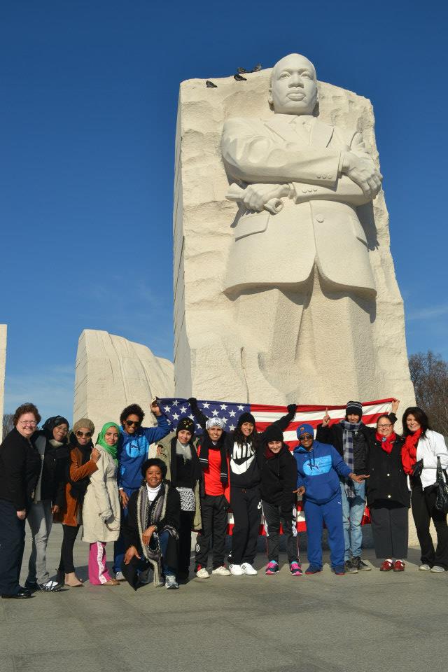 The delegation of coaches from Bahrain, Oman, Qatar, and Yemen group together in front of the Martin Luther King, Jr. monument in Washington, D.C.