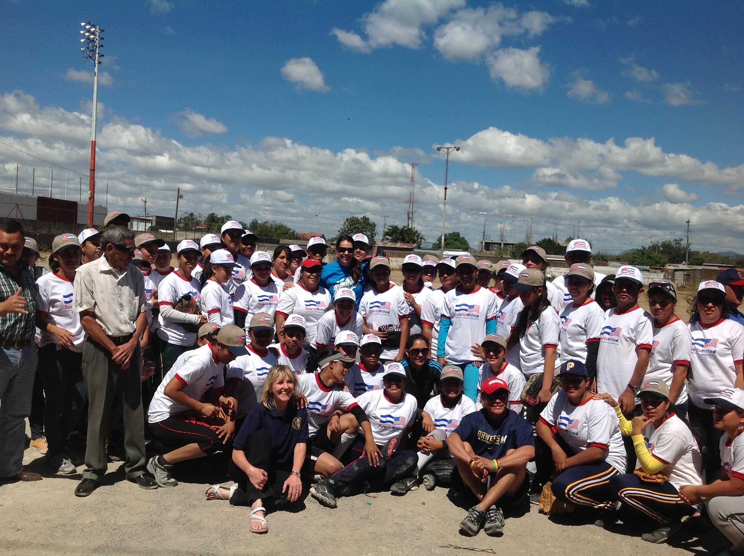 The envoys join in a group photo with Nicaraguan coaches and softball players.