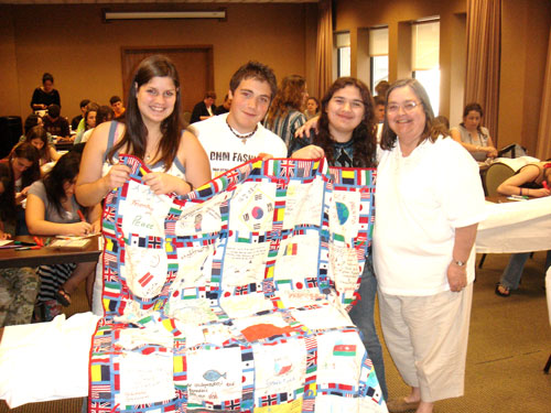A-SMYLE students make and donate quilts for an orphanage.