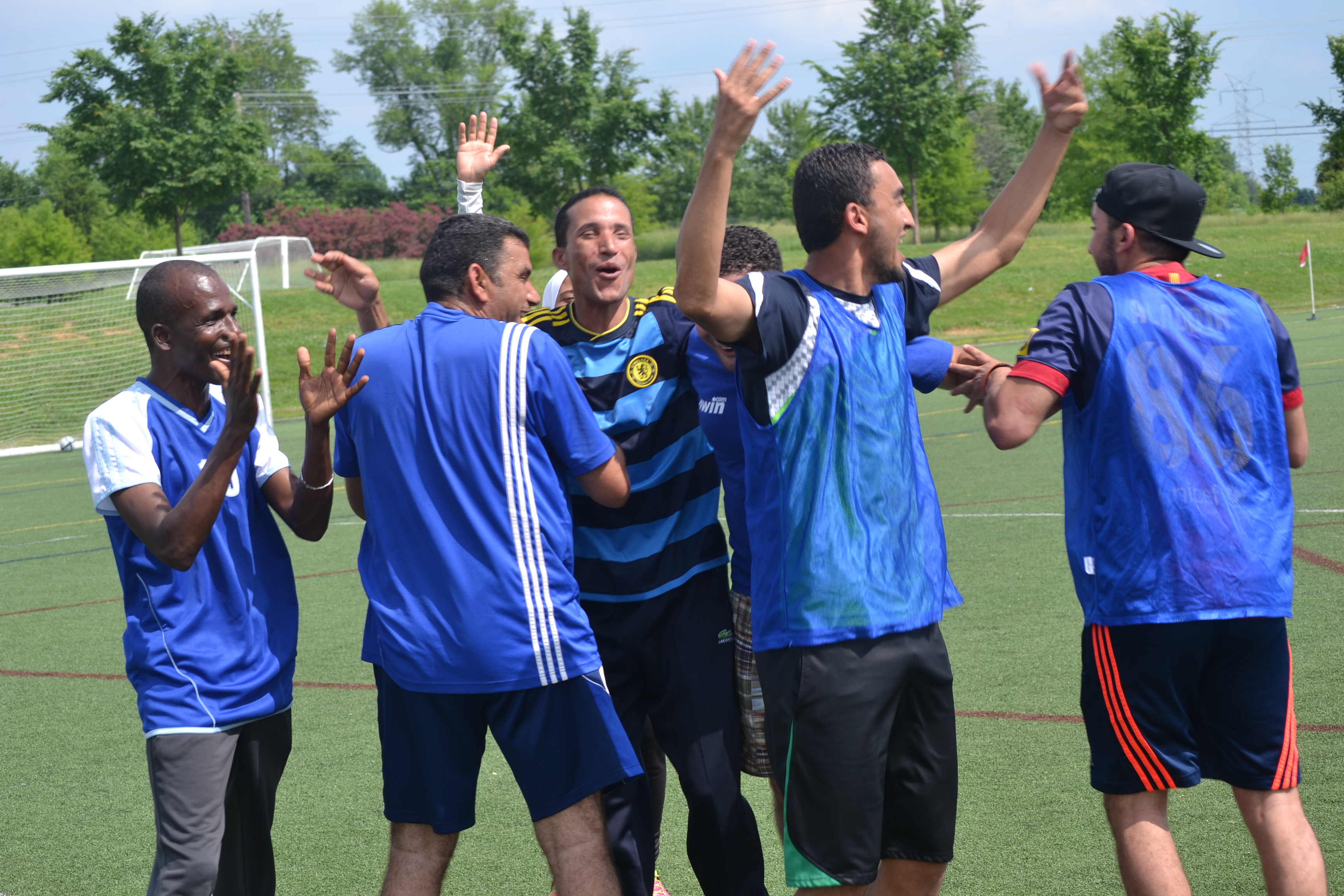 Some of the coaches share their excitement and love of soccer together during a clinic.