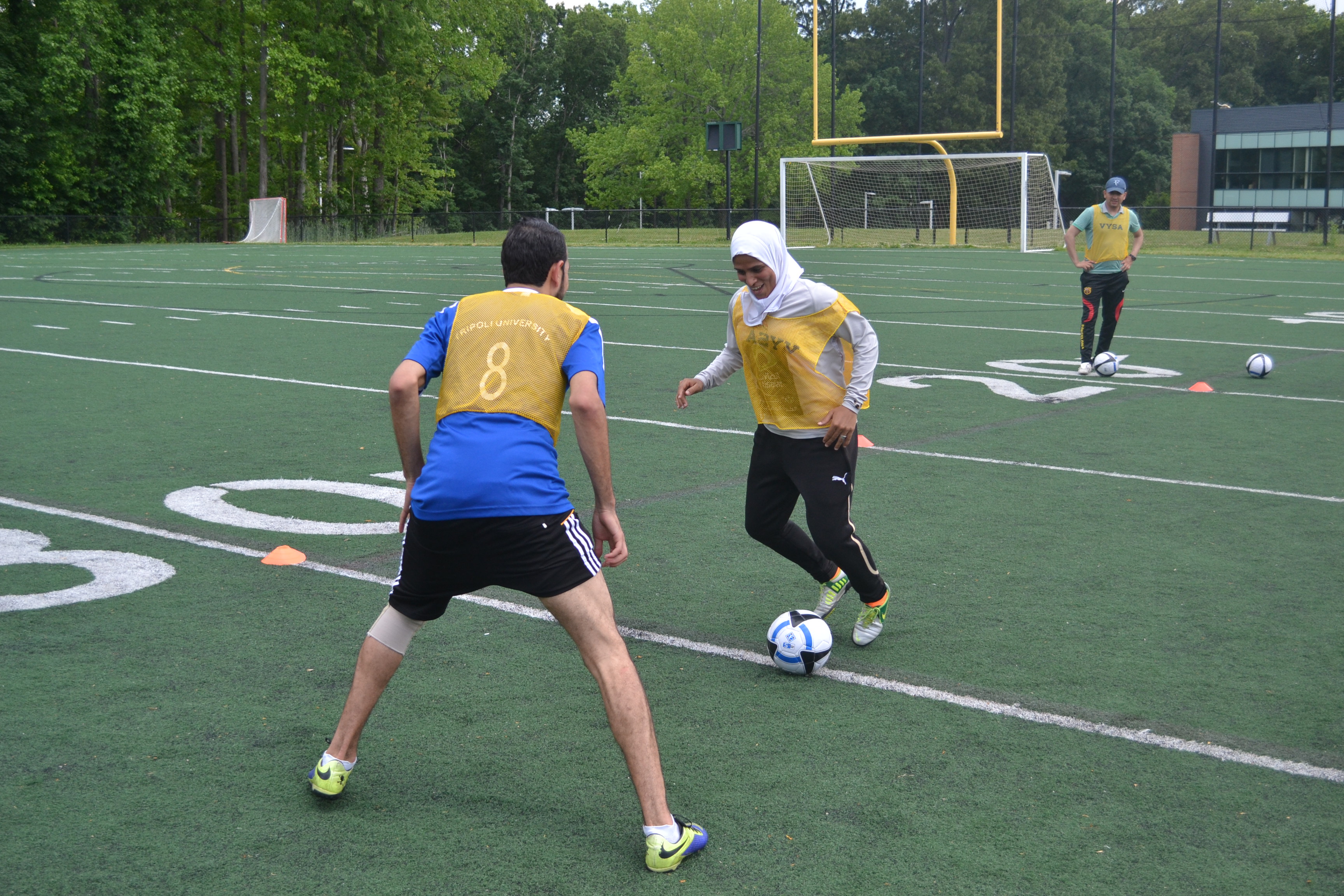 Athletes from Egypt and Libya go one on one during a drill.