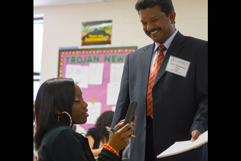Photo of TEA participant Siby Sebastian helping a student with algebra