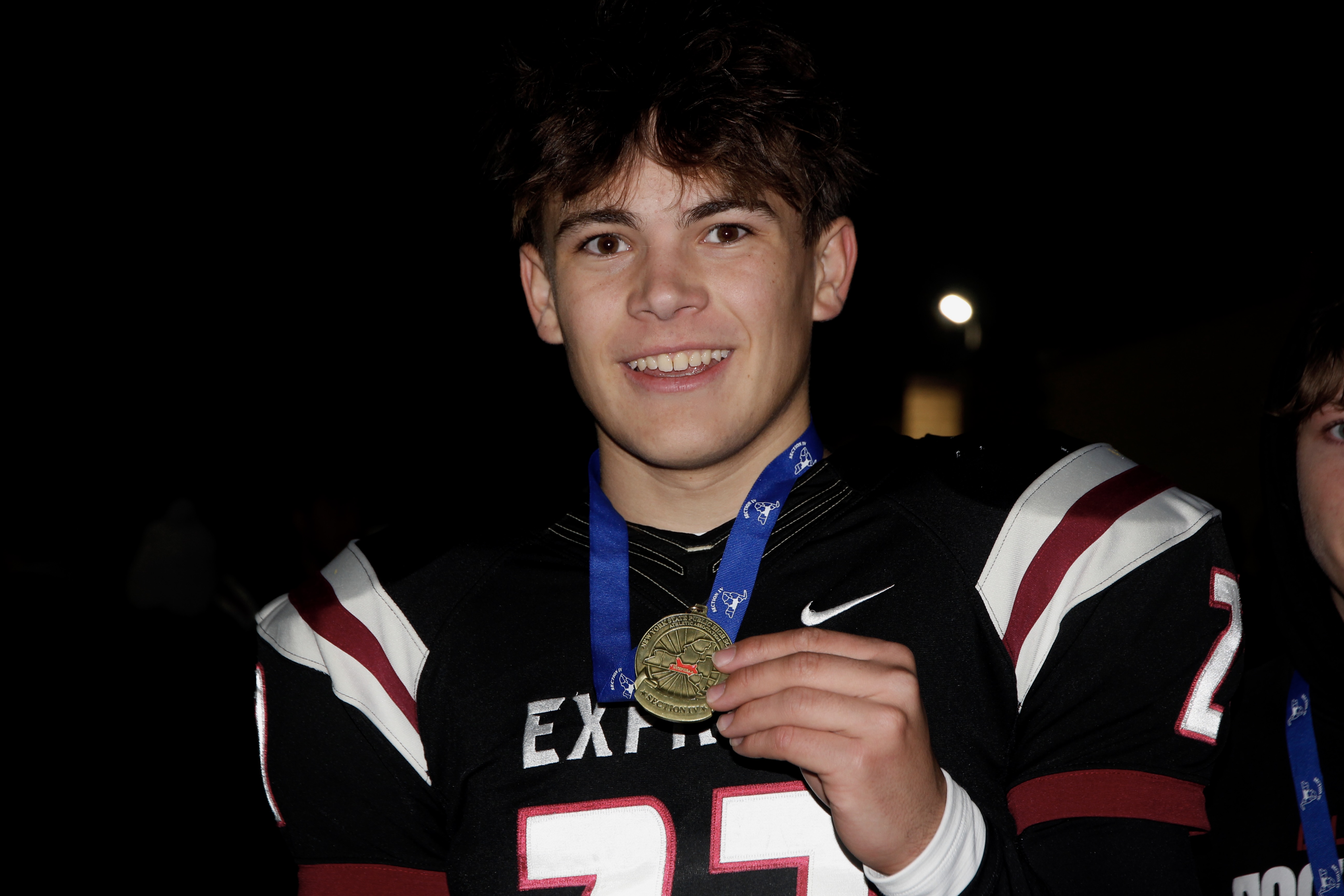 Jan celebrates Elmira High School’s victory in the New York State Public High School Athletic Association’s Section IV championship football game.