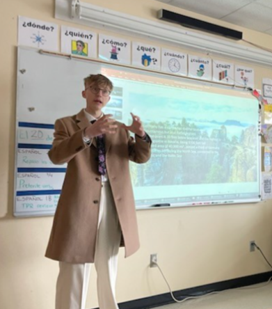 Laurence delivering a presentation on Germany to his classmates.