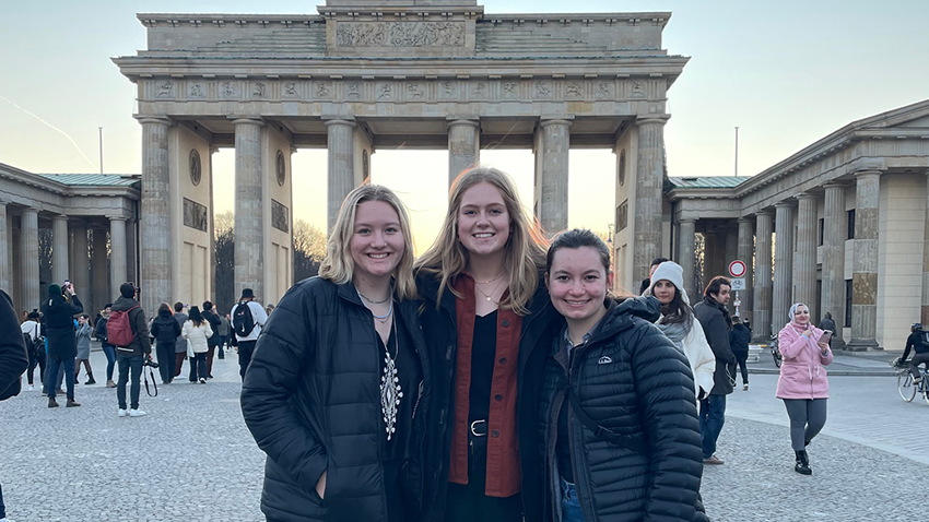Leah and two friends in a plaza