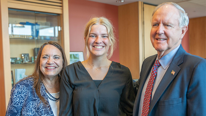 Mara Treder with two older people