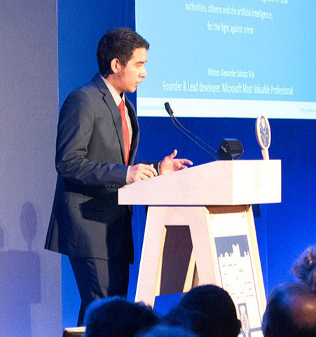 Young man stands at podium