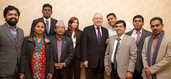 One group of participants pose for a picture with Ben Bradlee