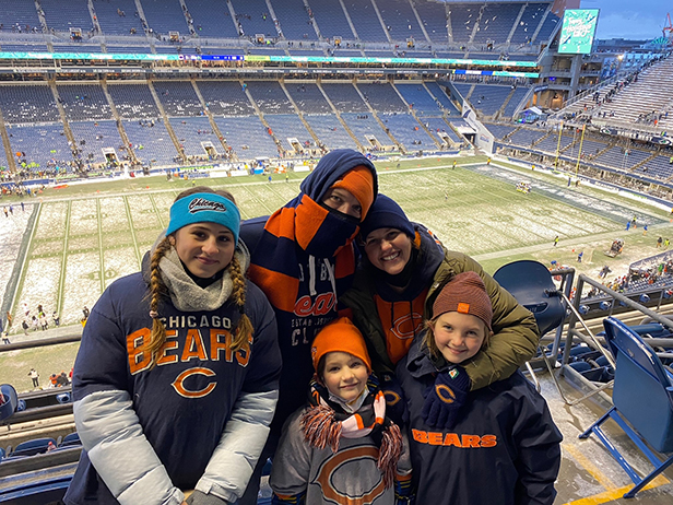 Nina with her host family at a football game