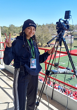 Noura behind a camera