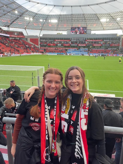 Phoebe (left) attends a soccer match in Germany with her host sister.