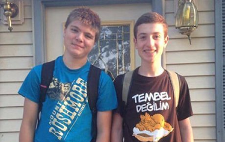 Davit Khutsishvili standing with host brother on first day of school