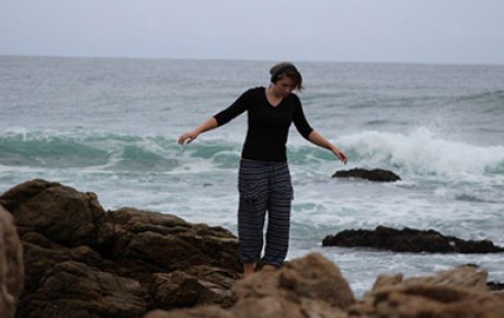 Erica walking near the surf in South Africa.