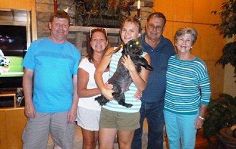 Anastasiya from Turkmenistan poses with her host family in Trussville, Alabama.