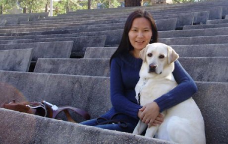 Fulbright Foreign Student alumna Uyanga Erdenebold with her seeing-eye dog, Gladys.