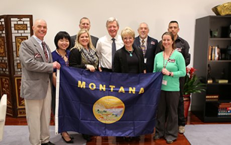 U.S. Ambassador to China Max Baucus, a former Senator from Montana, meets with the Sport for Social Change group at the U.S. Embassy in Beijing.