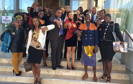 MWF alumni and their Mentees at the Namibia Connect Camp for the Young African Leaders Initiative, showing hands in the shape of Namibia.