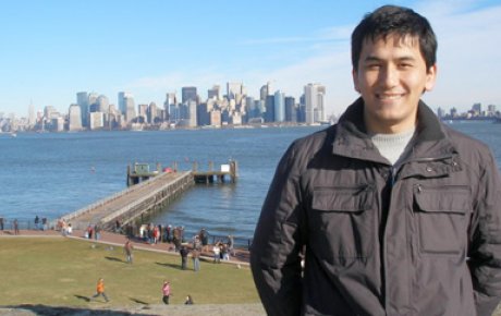 Nodirjon poses on Ellis Island in New York City, NY.