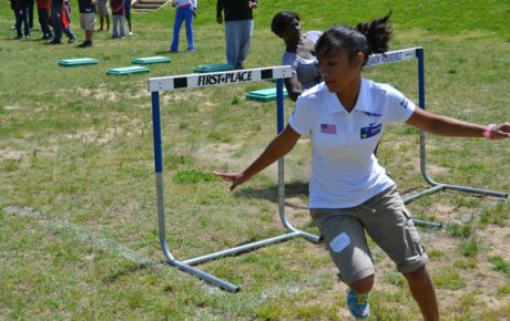 The sports visitors learn new track and field techniques and exercises at a clinic in Washington.