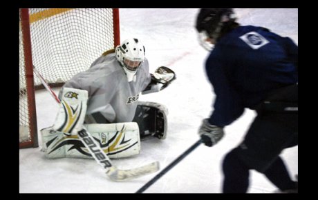 A Russian visitor tries to deke a Washington Pride goalie.