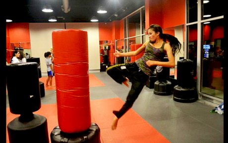 A Tajik coach practices her kick in one of the many training sessions.