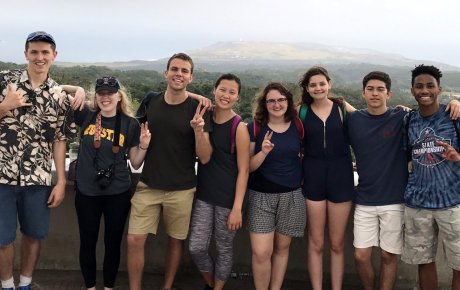 Group of teens and young adults with large mountain in background