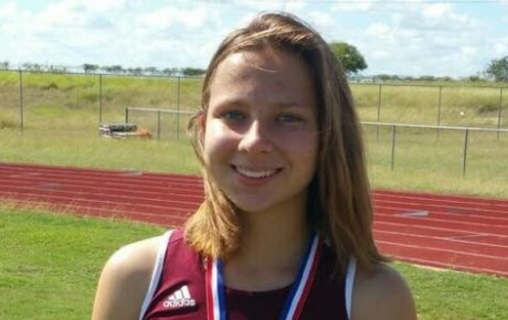 Close up of girl standing on track field