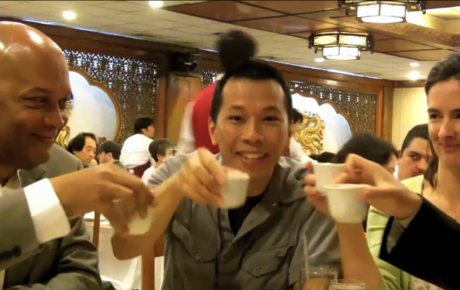 "Citizen Diplomats" from the National Council for International Visitors raise their tea cups in a gesture meant to welcome visitors from around the world.