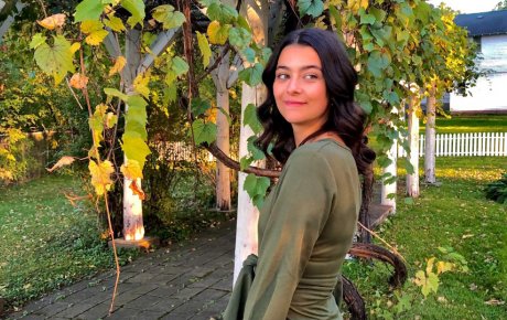 Image of Leni standing among plants