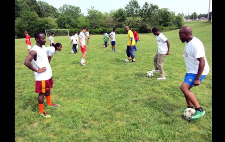 Swaziland coaches practicing with the varsity soccer team from C.D. Hylton High School.