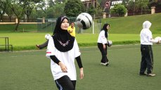 A young Malaysian athlete works on her ball handling skills during a clinic in Kuala Lumpur.