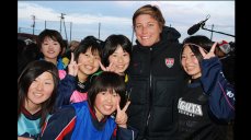 U.S. soccer forward, Abby Wambach, meets some potential future members of Japan's national soccer team.