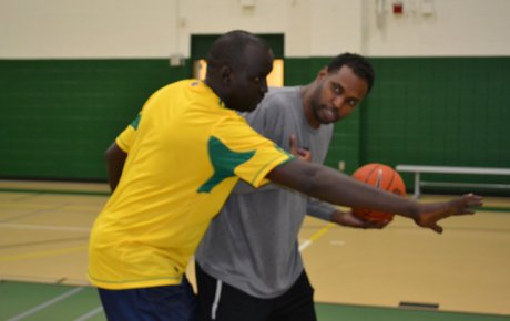 One of the participants shares tips on shooting with a D.C.-area coaching peer.