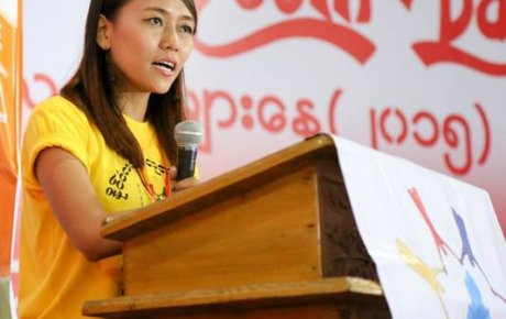 Girl at podium with mic in hand