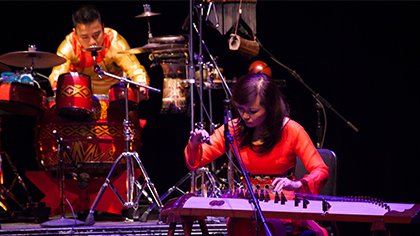 Phạm Trà My, đàn tranh (16 string zither), and Hà Đình Huy, drums and percussion, of the Trí Minh’s Quartet perform at the Kennedy Center's Millennium Stage. 