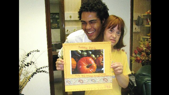 Brazilian filmmaker with a student at the Carriage House Arts Center in Albany.