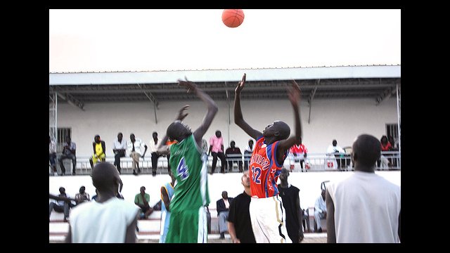 The boys start the game with a tip-off.