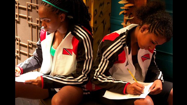 Participants work on their personal action plans to help develop girl’s sports programs in Trinidad.