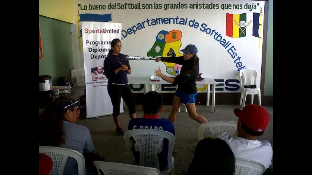 Jessica Mendoza and Ruby Rojas lead a batting clinic for coaches.