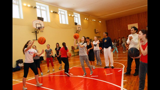 Nykesha Sales leads athletes during a shooting clinic while a Ukrainian coach observes to pick up on tips for the future. 