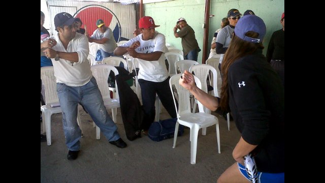 Softball coaches in Nicaragua practice batting stances and learn new coaching techniques from Jess Mendoza.