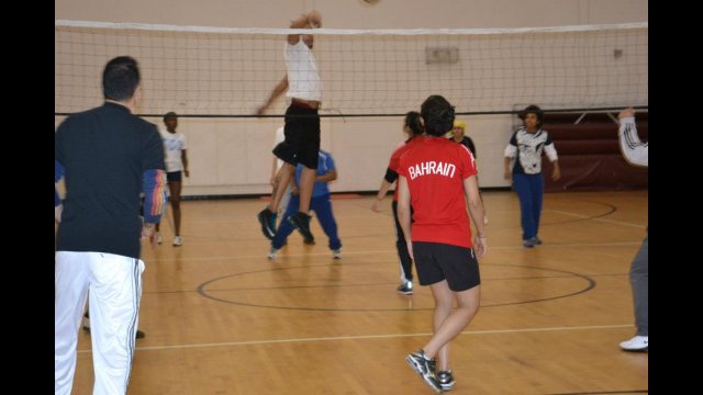 The female volleyball coaches take part in a friendly game with Americans. 