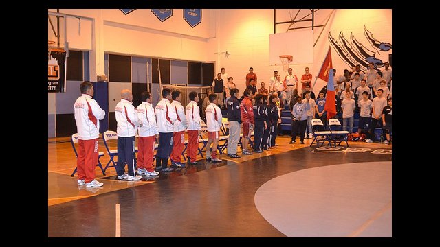 The Mongolian wrestling delegation lines up before a dual in New York.