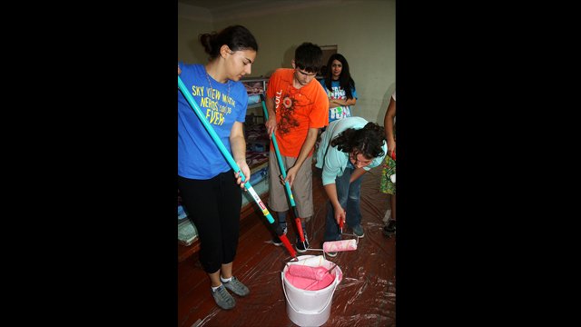 Second Place: &quot;Painting Walls in an Orphanage&quot;