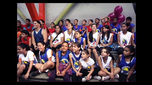 Clinic participants watch the activities in the gymnasium in Chacao, Venezuela.