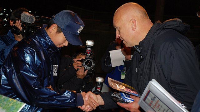 Cal Ripken visits a former participant from a State Department sports exchange program.