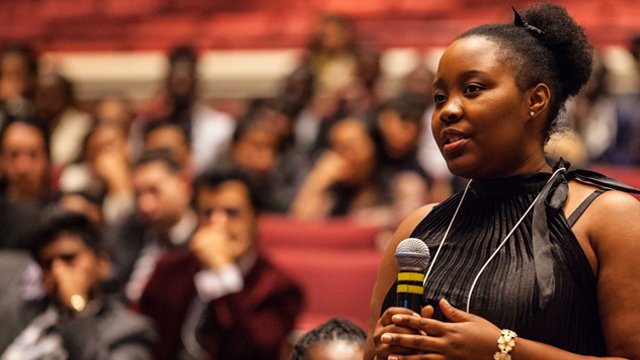 Girl holding a microphone at a conference