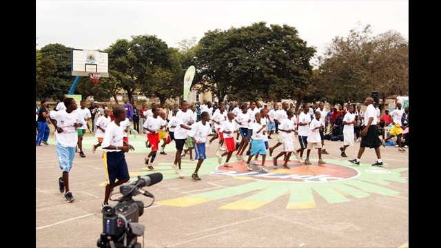 Young Congolese athletes warm up for their basketball clinic.