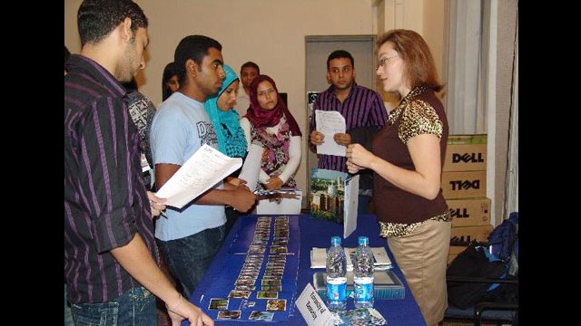 Advisers and students at a College Fair in Egypt.